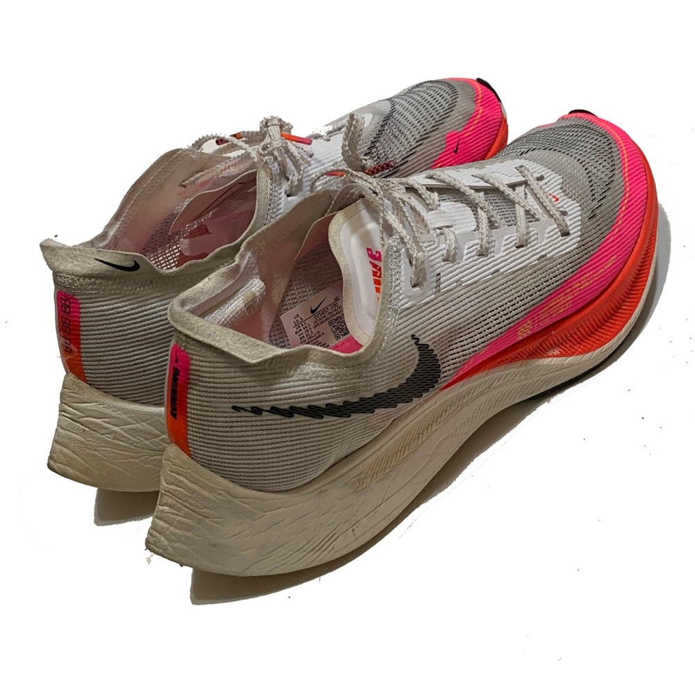 10.5 / Nike Pink and White Running Shoes